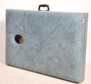 A retro 1970's folding massage table upholstered i