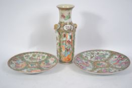 An Oriental Cantonese vase having lion mask handle