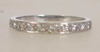 An 18ct white gold and diamond ladies half eternit