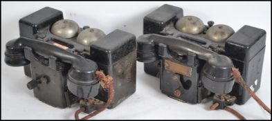 A pair of early 20th century intercom telephones i