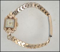 A hallmarked 9ct gold Verity cocktail watch with p