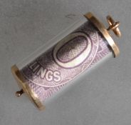An unusual 9ct gold charm with inset 10/- bank not