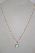 A hallmarked 9ct gold pendant necklace strung with