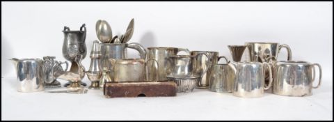 A collection of silver plated items to include a t