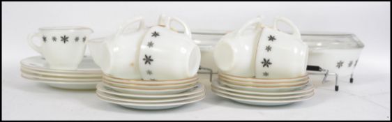 A mid century retro Pyrex glass dinner service. Th