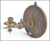 A 19th century brass hinged decorative brass candl