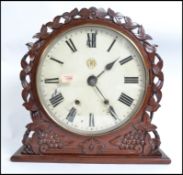 A GWR railway station clock set within a mahogany