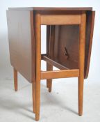 A 1970's teak wood drop leaf dining table having s