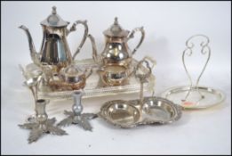 A silver plate tea and coffee service having a gal