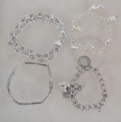 A collection of 4 silver bracelets to include doub