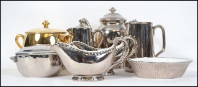 A Royal Worcester silver lustre wear tea service consisting of tea pot, water pot, creamer etc along