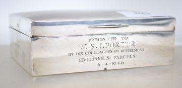 A silver hallmarked cigarette box with fitted inte