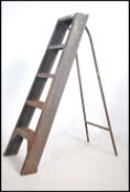 A mid century Industrial enamel painted metal ladd