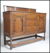 A good 1920's oak Jacobean revival sideboard being