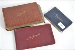 A vintage postcard album with cards to include Bir