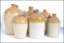 A group of 6 vintage stoneware flagons, some with