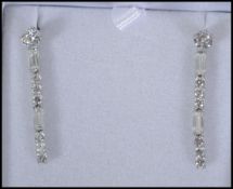 A pair of ladies silver and xz adorned earrings co