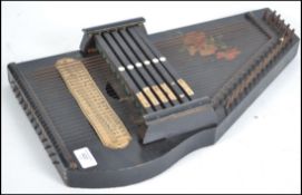 Musical Instruments. A 19th century hand held harp