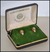 A pair of hallmarked 18ct gold and white sapphire