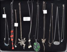 A group of 10 silver and other necklaces with pend