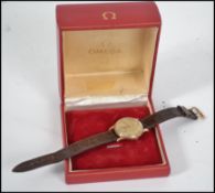 A vintage mid century 9ct gold Omega gents wrist w