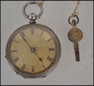 An early 20th century silver key wound pocket fob