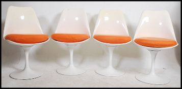 A set of Arkana style tulip chairs with white fini