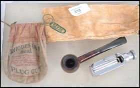 A vintage 20th century pipe together with an unusu