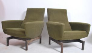 A stunning pair of mid century armchairs in the st
