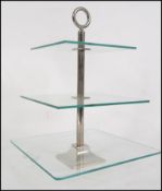 A glass and silver plated three tier cake stand su