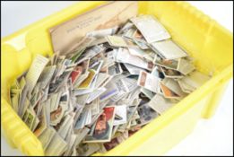 A large collection of loose cigarette cards to inc