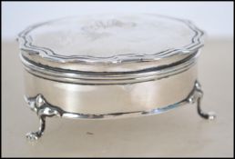 An Edwardian silver pill pot with fitted hinged li