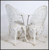 An antique style cast metal garden furniture patio