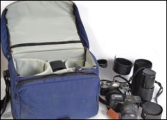 A collection of vintage 35mm cameras and accessori