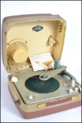 A retro mid century portable record player in two