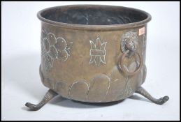 A 19th century copper coal / log box raised on hai