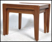 A pair of 20th century retro teak side / occasiona