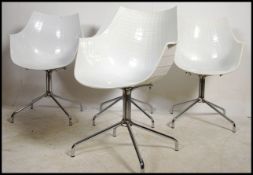A 20th century set of 4 dining chairs made for DWE