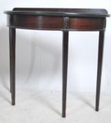 An Edwardian mahogany demi - lune console hall tab