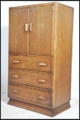 A 1930's Art Deco tallboy chest of drawers in oak