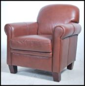 A comfortable contemporary leather tub chair. In b