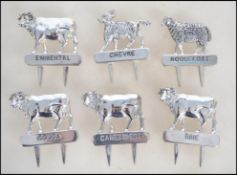 A collection of six different double pronged  silv