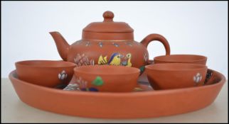 A Chinese Yi - Xing terracotta tea pot with four m