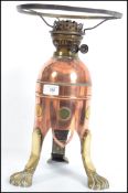 An unusual copper and brass oil lamp fitted with a
