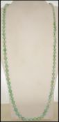 A vintage jade bead necklace consisting of graduat