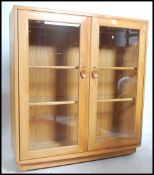 A good Ercol Windsor elm wood display cabinet havi