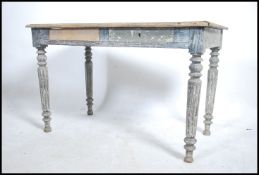 A rustic early 20th century shabby chic writing ta