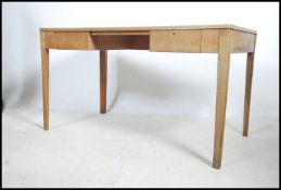 A 1955 Air ministry oak campaign desk being raised