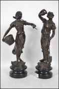 A pair of hollow cast bronze figures, each being r