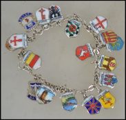 A  vintage silver bracelet strung with enamelled p